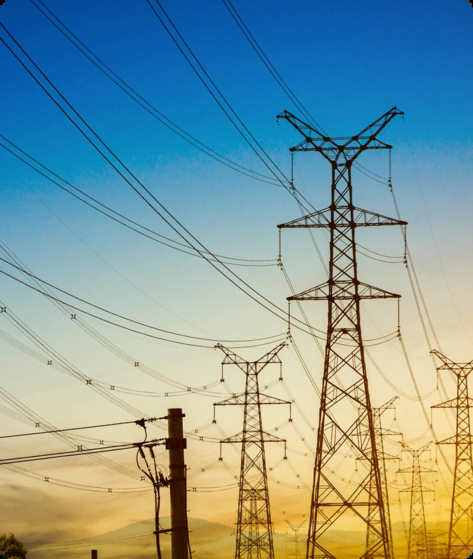 Power transmission towers at sunset